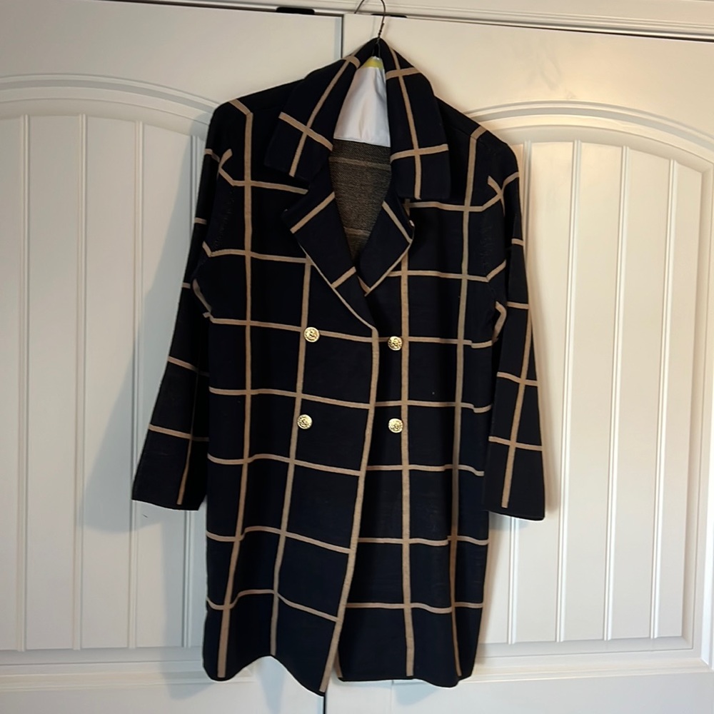 New without tags. Beautiful sweater jacket for spring